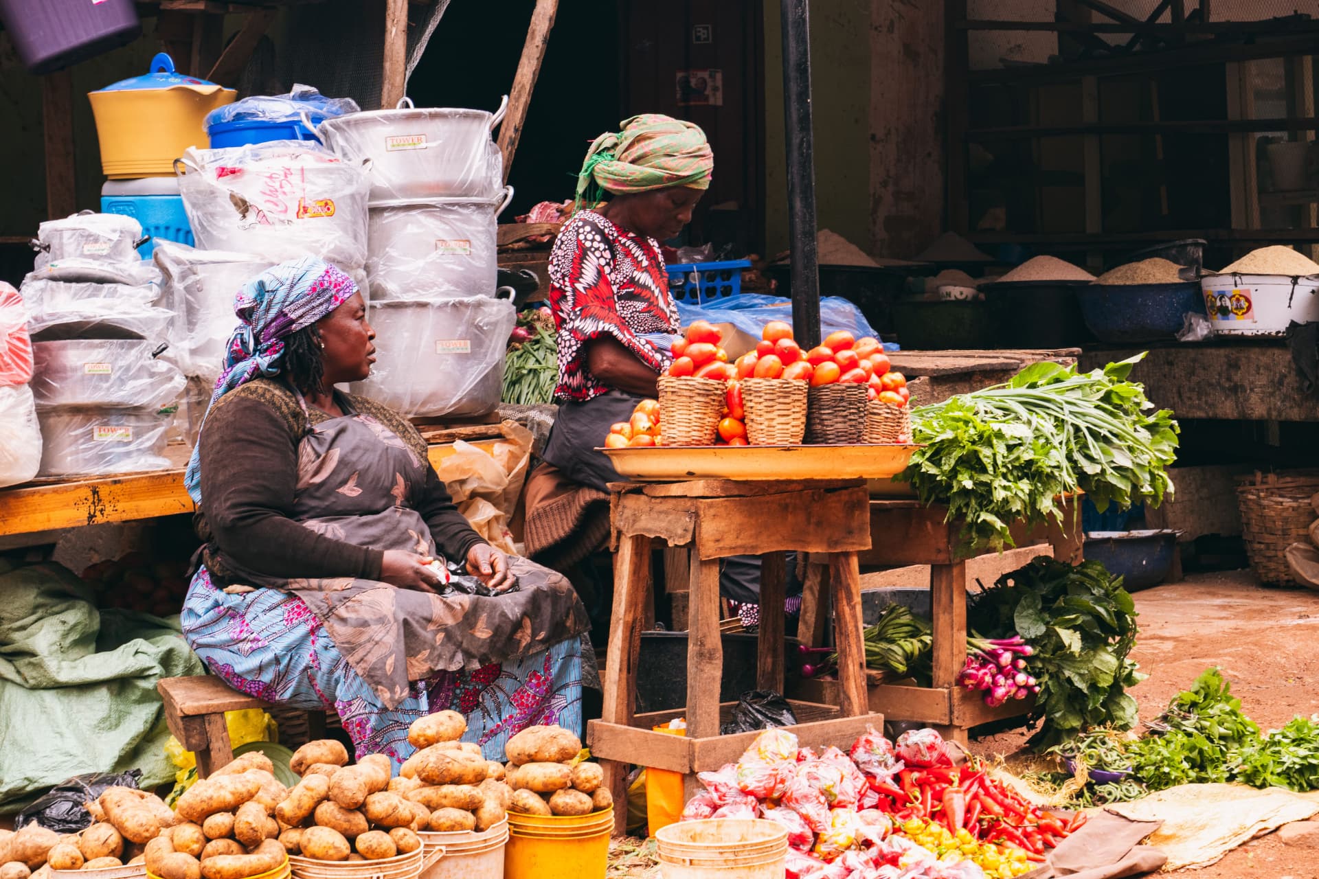 Women selling fresh produce at a market